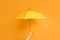 Hand with stylish umbrella on color background