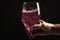 hand subtle touch on foam sparkled wine filled in glass