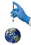 Hand with a syringe over the Earth