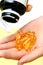 Hand take vitamin Omega-3 fish oil pills