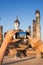 A hand taking photo of Buddha statue with smartphone, Sukhothai, Thailand