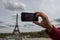 Hand taking selfie at Paris tour eiffel