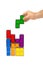 Hand with tetris toy blocks