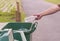 Hand throwing bottle in trash cans