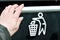 Hand throwing garbage in empty recycling bin