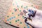 Hand throwing white dice background colorful blurred Board game. The dynamic moment of the game, selective focus.