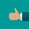 Hand with thumb up isolated on turquoise background. good, cool, like symbol