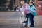 Hand, thumbs up and senior women with disability in a road for travel, fun and waiting for taxi in a city. Elderly