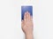 Hand on top of a single blue tarot card