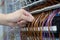 Hand touching the electrical wires in electrical terminal blocks