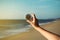 Hand traveler woman holding compass at the beach,Navigation for travel,Close up