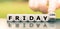 Hand turns a dice and changes the expression `friday 12th` to `friday 13th.