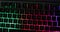 Hand typing `love` on the RGB gaming keyboard. Valentine`s Day concept