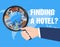 Hand use magnifying glass find hotel for travel