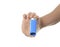 Hand using an asthma inhalator