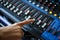 Hand using mixing console,Sound recording studio mixing desk wit