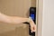 Hand using smartwatch for open digital door lock at home or apartment. NFC Technology, Fingerprint scan, keycard, PIN number,