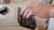 Hand is using Vintage typewriters on wooden table