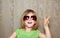 Hand victory gesture little girl funny sunglasses