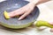 Hand wash dirty pans of food stains on light background