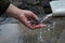 Hand washing a handmade knife under running water