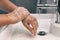 Hand washing personal hygiene woman washing hands rubbing soap for 20 seconds following steps, cleaning wrists and