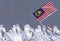 Hand waving Malaysia flag also known as Jalur Gemilang