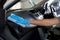 Hand wearing rubber gloves, clean the car interior, Console car cleaning