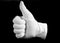 Hand in a white cotton glove gesturing a thumbs up
