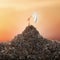 Hand with a white flag sticks out of a pile of debris