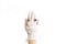 Hand in white medical glove with luxury rings on fingers on white background. Fashion and quarantine. Skin protection, prevention