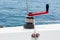 Hand winch on a sailboat while sailing.