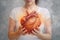 hand woman cholesterol charity concept red cardiology help heart donor health. Generative AI.