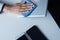 Hand woman cleaning dirty her tablet on screen with microfiber cloth