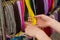 Hand of woman with colorful necklace on stall at the bazaar