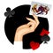 Hand of woman holding Joker playing card on the round black back