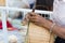 Hand of woman holds The villagers took bamboo stripes to weave into different