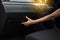 Hand woman open glove compartment box inside new modern car