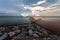 Hand of woman  and origami birds Origami Crane on a background of sea and sky with silhouette sky, freedom concept