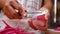 Hand of woman peeling the red radish to prepare delicious food in kitchen at home. Cooking concept.