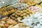 Hand of a woman picking up Homemade Moroccan pastries displayed