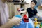 Hand of woman is spraying alcohol antiseptic,disinfecting toys,cleaning toys at home,disinfection,health care during a pandemic of