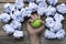 Hand of a woman squeezing a stress ball with crumpled paper on the table