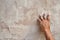 hand of worker plastering cement at the wall for building house