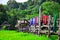 Hand woven clothes hang on wooden walkways in rice field atSila Laeng, Pua District, Nan