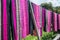 Hand woven clothes hang on wooden walkways in rice field at Sila Laeng, Pua District, Nan