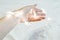 Hand wrapped in a weaving garland on a white background