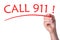 Hand writes word call 911 with red marker