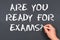 Hand writing chalk on a blackboard text: Are You Ready For Exam