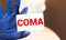 Hand writing COMA with the abstract background. The word COMA represent the meaning of word as concept in stock photo